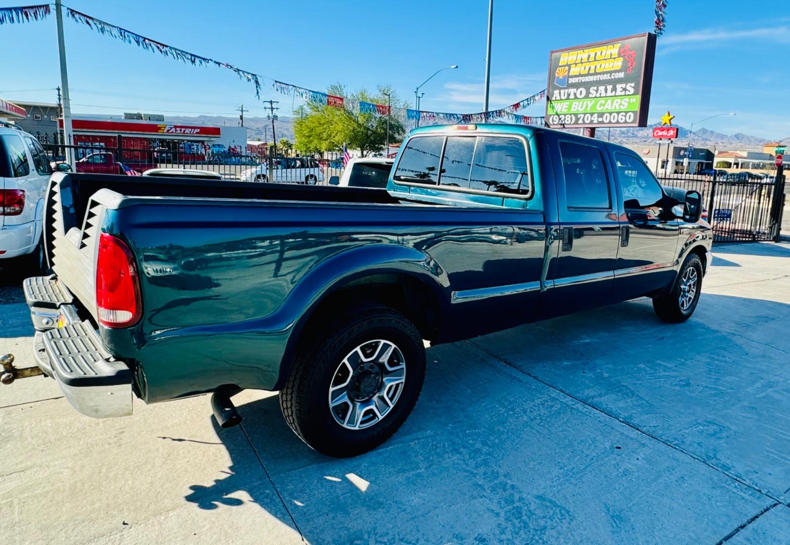 1999 Green Ford F-250 SD Lariat Crew Cab LWB 2WD (1FTNW20F4XE) with an 7.3L V8 OHV 16V TURBO DIESEL engine, located at 2190 Hwy 95, Bullhead City, AZ, 86442, (928) 704-0060, 0.000000, 0.000000 - 1999 Ford F250 crew cab long bed 7.3 powerstroke diesel. seats 6. fresh new paint. new window tint. brand new stereo with bluetooth. Completely serviced, lots of new parts. new ac system Ice cold a/c. runs and drives great. financing available. - Photo#8