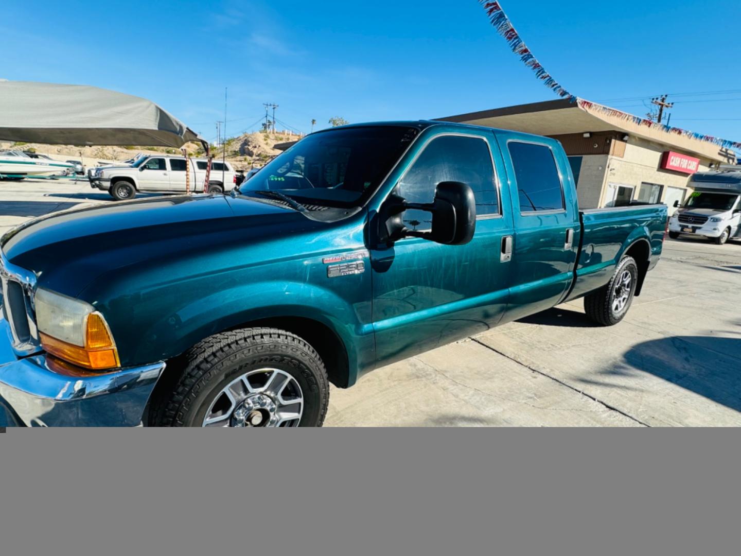 1999 Green Ford F-250 SD Lariat Crew Cab LWB 2WD (1FTNW20F4XE) with an 7.3L V8 OHV 16V TURBO DIESEL engine, located at 2190 Hwy 95, Bullhead City, AZ, 86442, (928) 704-0060, 0.000000, 0.000000 - 1999 Ford F250 crew cab long bed 7.3 powerstroke diesel. seats 6. fresh new paint. new window tint. brand new stereo with bluetooth. Completely serviced, lots of new parts. new ac system Ice cold a/c. runs and drives great. financing available. - Photo#9