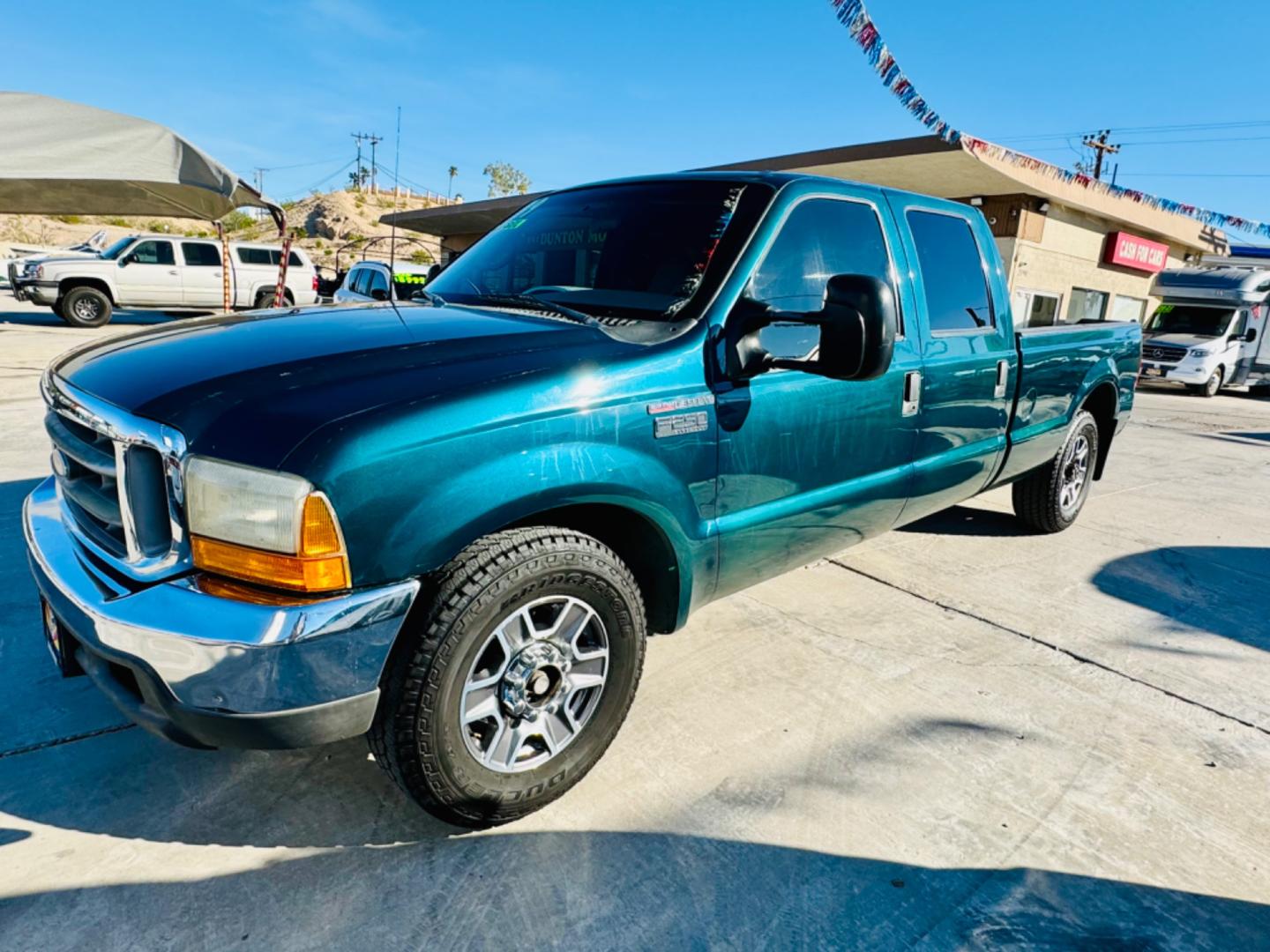 1999 Green Ford F-250 SD Lariat Crew Cab LWB 2WD (1FTNW20F4XE) with an 7.3L V8 OHV 16V TURBO DIESEL engine, located at 2190 Hwy 95, Bullhead City, AZ, 86442, (928) 704-0060, 0.000000, 0.000000 - 1999 Ford F250 crew cab long bed 7.3 powerstroke diesel. seats 6. fresh new paint. new window tint. brand new stereo with bluetooth. Completely serviced, lots of new parts. new ac system Ice cold a/c. runs and drives great. financing available. - Photo#0