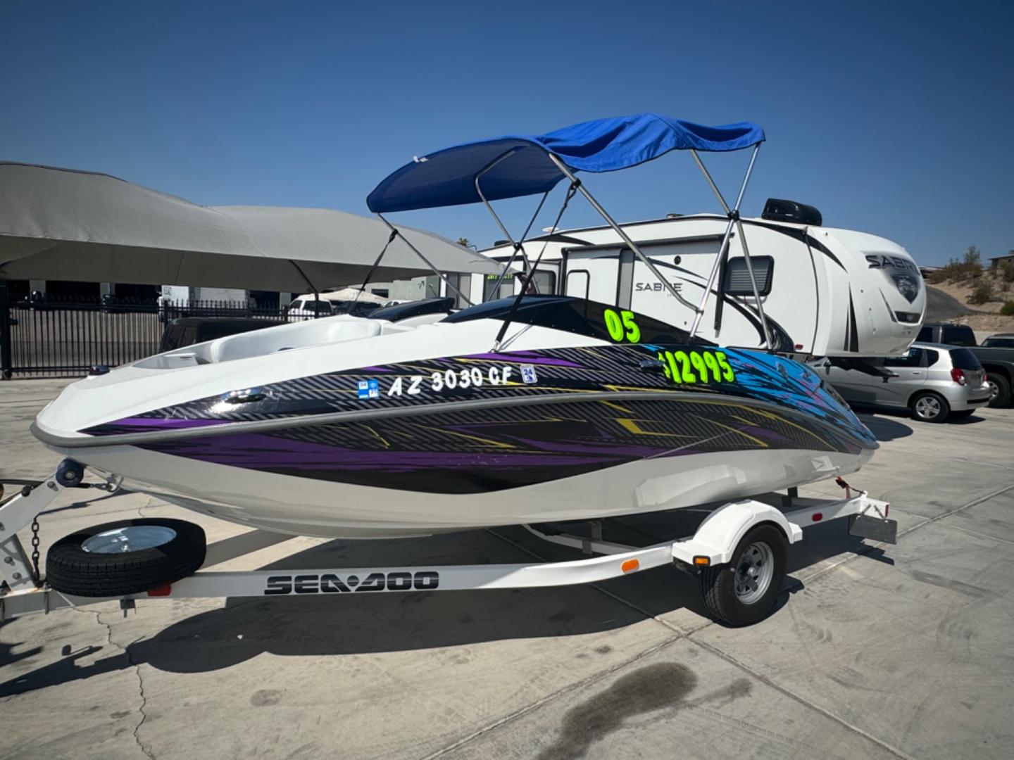 2005 White /white/blue Sea Doo Challenger 180 , located at 2190 Hwy 95, Bullhead City, AZ, 86442, (928) 704-0060, 0.000000, 0.000000 - on consignment. 2005 Sea Doo Challenger 180. 18ft with 4 tech 4 stroke engine. runs and drives great. only 86 hours. That's right 86 hours on the engine. Recently serviced. newer bimini top . stereo custom decals. spare tire. free and clear title for boat and trailer. - Photo#0