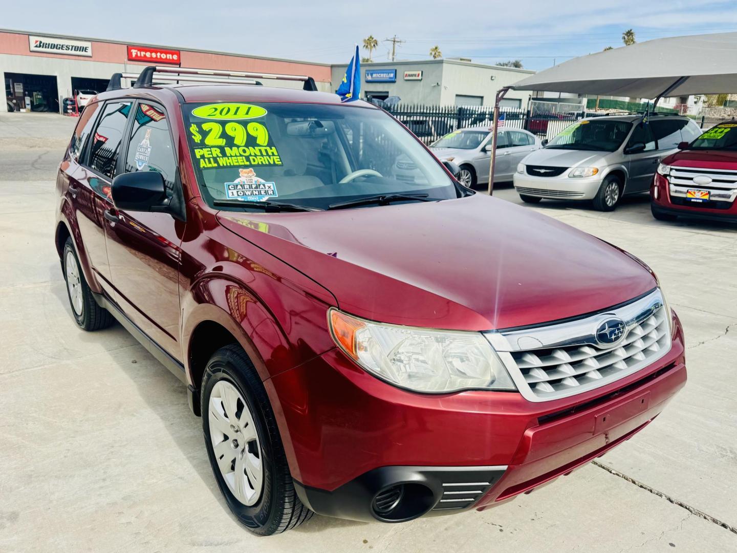 2011 Red Subaru Forester 2.5X (JF2SHAAC5BH) with an 2.5L H4 SOHC 16V engine, 4-Speed Automatic transmission, located at 2190 Hwy 95, Bullhead City, AZ, 86442, (928) 704-0060, 0.000000, 0.000000 - 2011 Subaru forester 2.5 X. All wheel drive. Only 106k miles. In house financing available. Buy here pay here. We finance. Free warranty. Free carfax. super clean . Brand new tires. - Photo#0