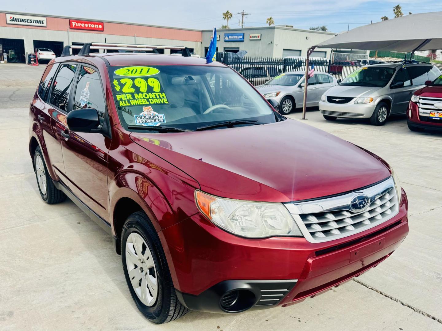 2011 Red Subaru Forester 2.5X (JF2SHAAC5BH) with an 2.5L H4 SOHC 16V engine, 4-Speed Automatic transmission, located at 2190 Hwy 95, Bullhead City, AZ, 86442, (928) 704-0060, 0.000000, 0.000000 - 2011 Subaru forester 2.5 X. All wheel drive. Only 106k miles. In house financing available. Buy here pay here. We finance. Free warranty. Free carfax. super clean . Brand new tires. - Photo#2