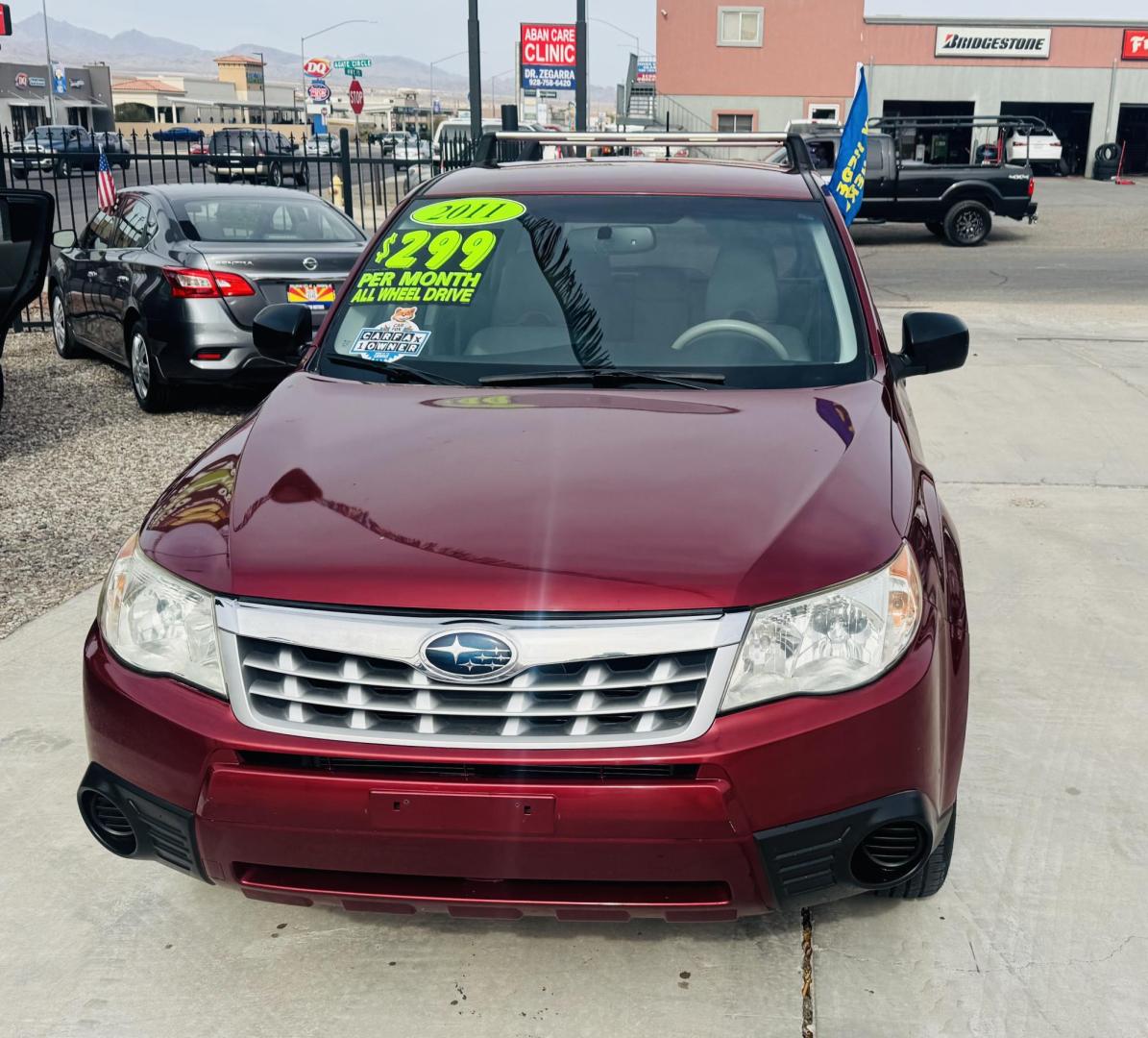 2011 Red Subaru Forester 2.5X (JF2SHAAC5BH) with an 2.5L H4 SOHC 16V engine, 4-Speed Automatic transmission, located at 2190 Hwy 95, Bullhead City, AZ, 86442, (928) 704-0060, 0.000000, 0.000000 - 2011 Subaru forester 2.5 X. All wheel drive. Only 106k miles. In house financing available. Buy here pay here. We finance. Free warranty. Free carfax. super clean . Brand new tires. - Photo#3