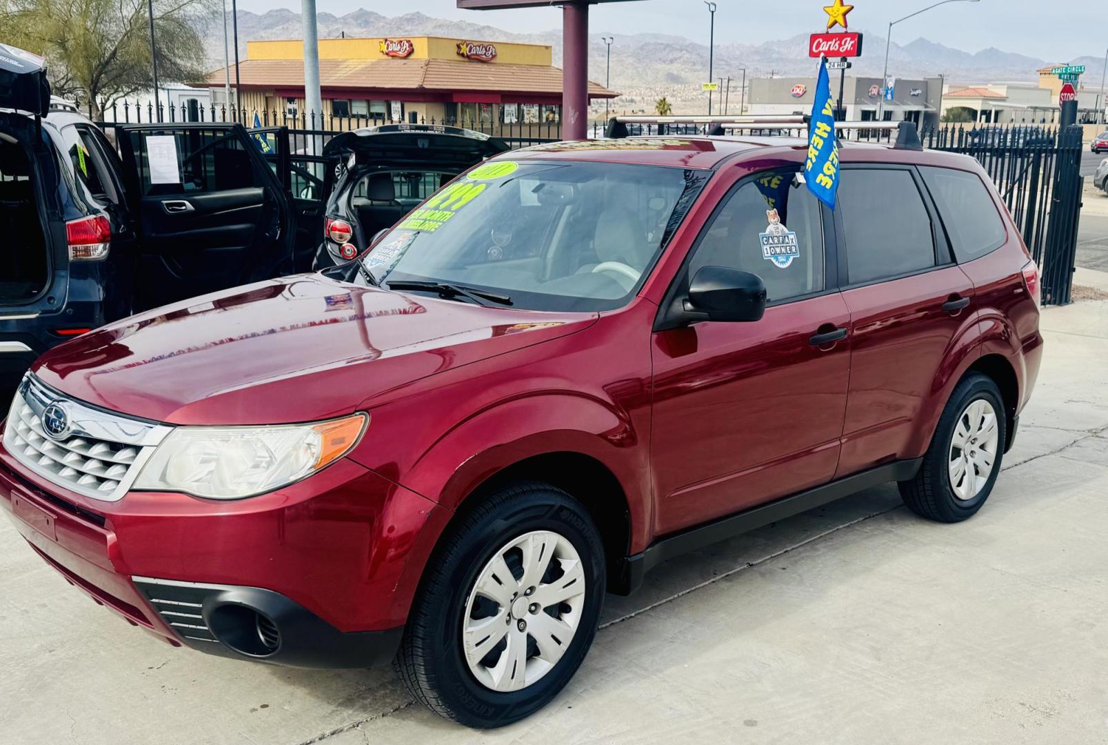 2011 Red Subaru Forester 2.5X (JF2SHAAC5BH) with an 2.5L H4 SOHC 16V engine, 4-Speed Automatic transmission, located at 2190 Hwy 95, Bullhead City, AZ, 86442, (928) 704-0060, 0.000000, 0.000000 - 2011 Subaru forester 2.5 X. All wheel drive. Only 106k miles. In house financing available. Buy here pay here. We finance. Free warranty. Free carfax. super clean . Brand new tires. - Photo#7