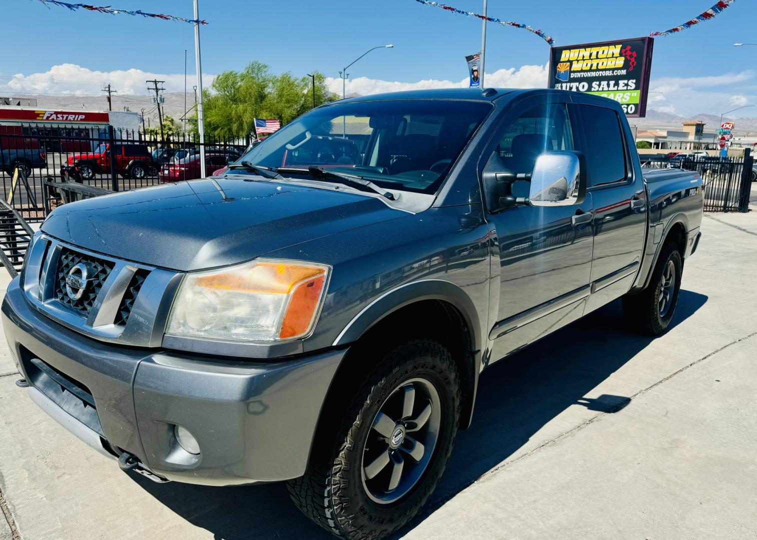 2014 grey Nissan Titan PRO-4X Crew Cab 4WD SWB (1N6AA0EC6EN) with an 5.6L V8 DOHC 32V engine, 5-Speed Automatic transmission, located at 2190 Hwy 95, Bullhead City, AZ, 86442, (928) 704-0060, 0.000000, 0.000000 - 2014 Nissan Titan crew cab 4x4. 2 owner. excellent condition. automatic, power windows, locks, tires in great shape. non smoker always garaged. elderly owned. has foldable cover for bed and carpeted bed mat. tow package. ice cold ac. just recently had complete service and all fluids changed. free an - Photo#1