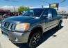 2014 grey Nissan Titan PRO-4X Crew Cab 4WD SWB (1N6AA0EC6EN) with an 5.6L V8 DOHC 32V engine, 5-Speed Automatic transmission, located at 2190 Hwy 95, Bullhead City, AZ, 86442, (928) 704-0060, 0.000000, 0.000000 - 2014 Nissan Titan crew cab 4x4. 2 owner. excellent condition. automatic, power windows, locks, tires in great shape. non smoker always garaged. elderly owned. has foldable cover for bed and carpeted bed mat. tow package. ice cold ac. just recently had complete service and all fluids changed. free an - Photo#1