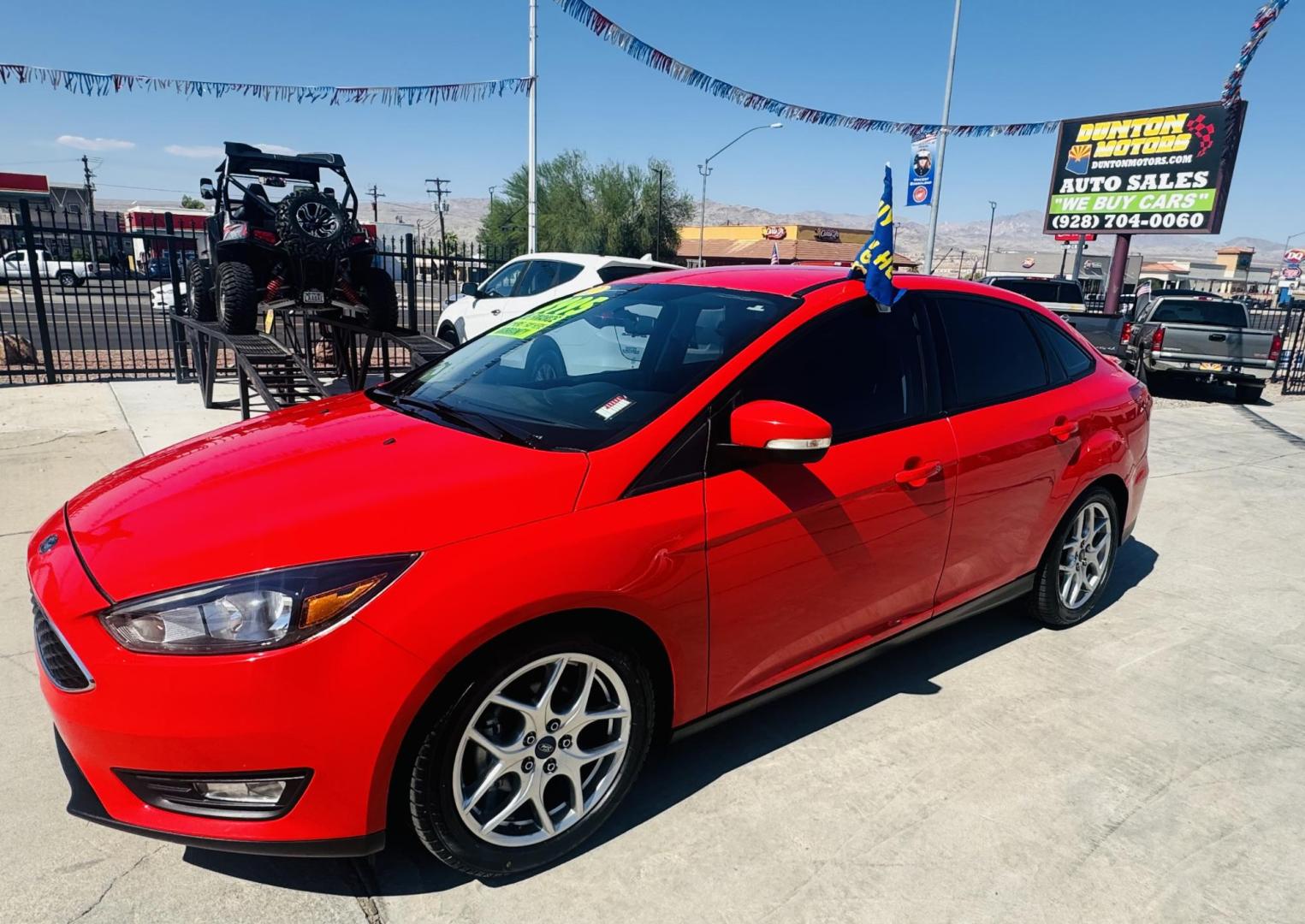 2015 Red Ford Focus SE Sedan (1FADP3F27FL) with an 2.0L L4 DOHC 16V engine, located at 2190 Hwy 95, Bullhead City, AZ, 86442, (928) 704-0060, 0.000000, 0.000000 - Photo#0