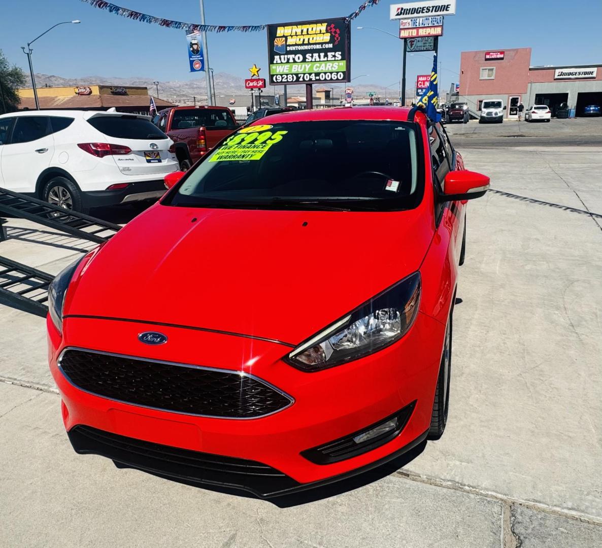 2015 Red Ford Focus SE Sedan (1FADP3F27FL) with an 2.0L L4 DOHC 16V engine, located at 2190 Hwy 95, Bullhead City, AZ, 86442, (928) 704-0060, 0.000000, 0.000000 - Photo#1