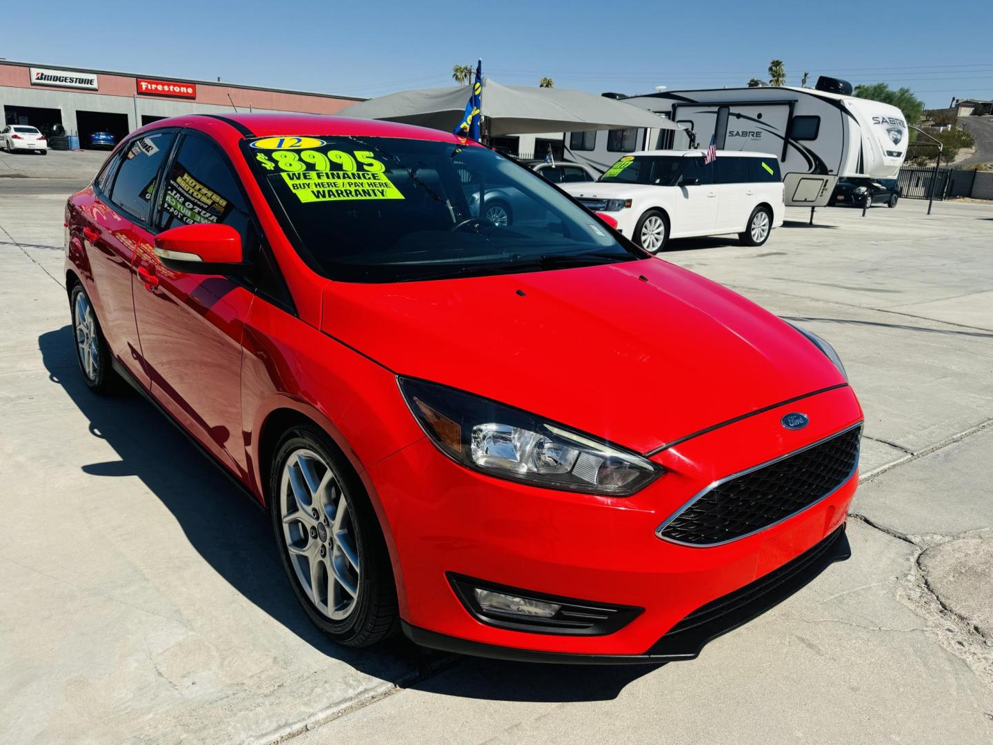 2015 Red Ford Focus SE Sedan (1FADP3F27FL) with an 2.0L L4 DOHC 16V engine, located at 2190 Hwy 95, Bullhead City, AZ, 86442, (928) 704-0060, 0.000000, 0.000000 - Photo#2