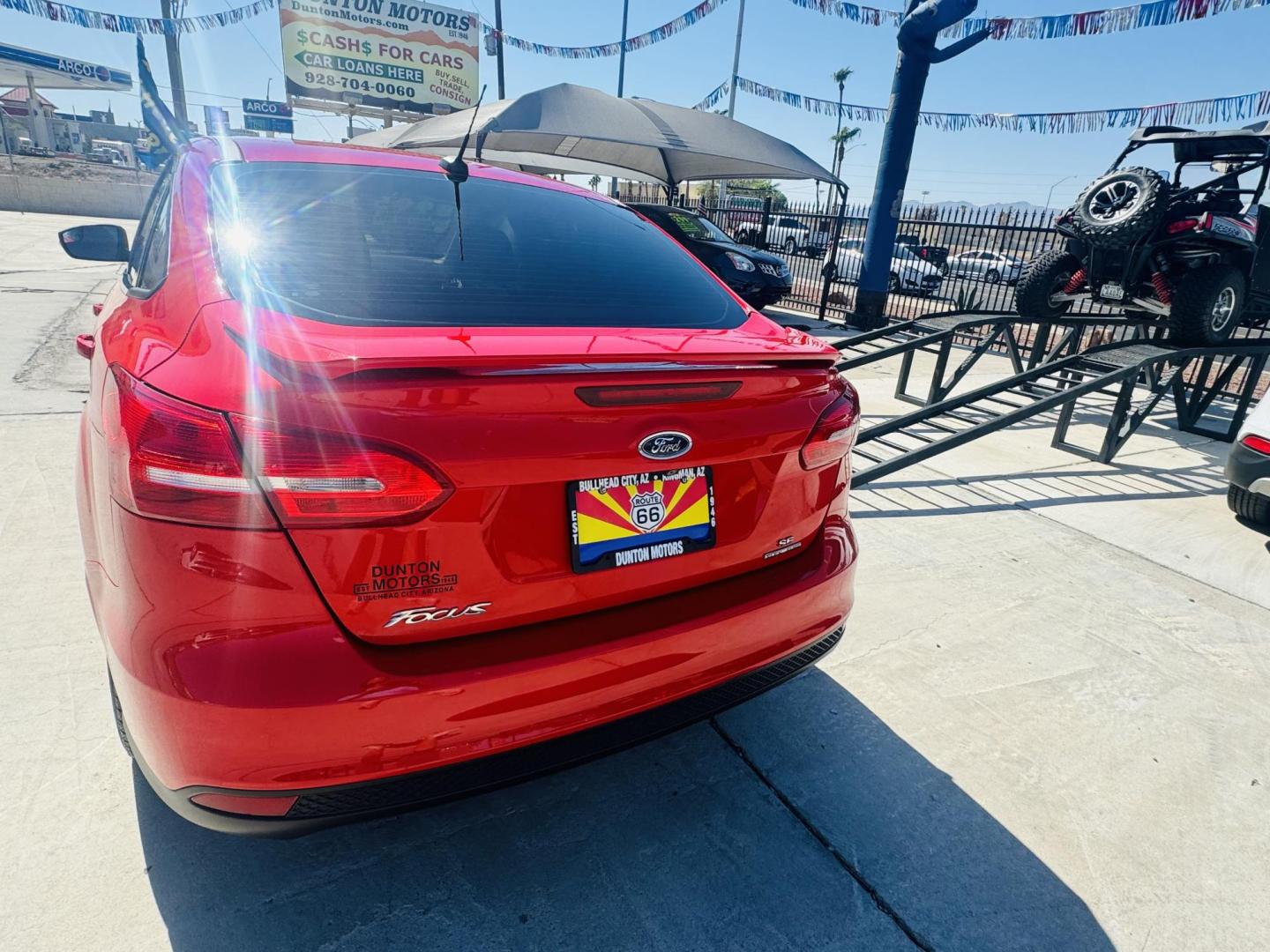 2015 Red Ford Focus SE Sedan (1FADP3F27FL) with an 2.0L L4 DOHC 16V engine, located at 2190 Hwy 95, Bullhead City, AZ, 86442, (928) 704-0060, 0.000000, 0.000000 - Photo#3