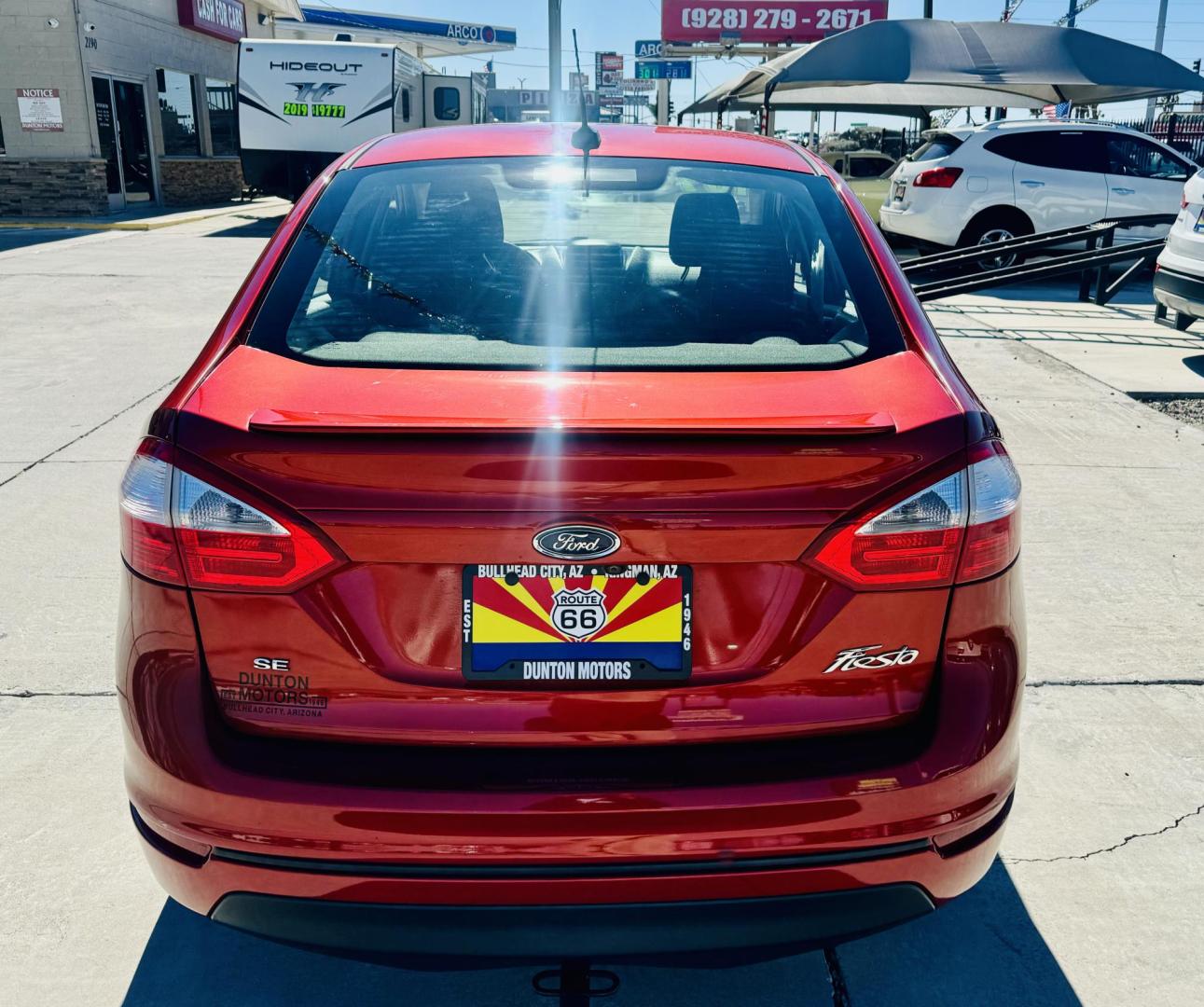 2019 Red Ford Fiesta SE Sedan (3FADP4BJ8KM) with an 1.6L L4 DOHC 16V engine, located at 2190 Hwy 95, Bullhead City, AZ, 86442, (928) 704-0060, 0.000000, 0.000000 - On consignment. This super clean tow behind Ford Fiesta SE. Manual transmission. Tow behind set up included. Moonroof, backup camera, bluetooth, keyless entry, power windows, locks. cold ac. rear spoiler. 2 owner, clean carfax. Financing available. - Photo#2