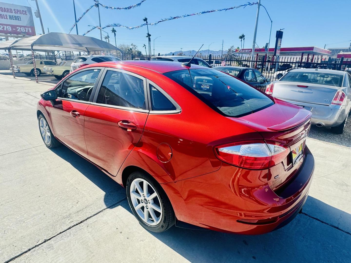 2019 Red Ford Fiesta SE Sedan (3FADP4BJ8KM) with an 1.6L L4 DOHC 16V engine, located at 2190 Hwy 95, Bullhead City, AZ, 86442, (928) 704-0060, 0.000000, 0.000000 - On consignment. This super clean tow behind Ford Fiesta SE. Manual transmission. Tow behind set up included. Moonroof, backup camera, bluetooth, keyless entry, power windows, locks. cold ac. rear spoiler. 2 owner, clean carfax. Financing available. - Photo#4