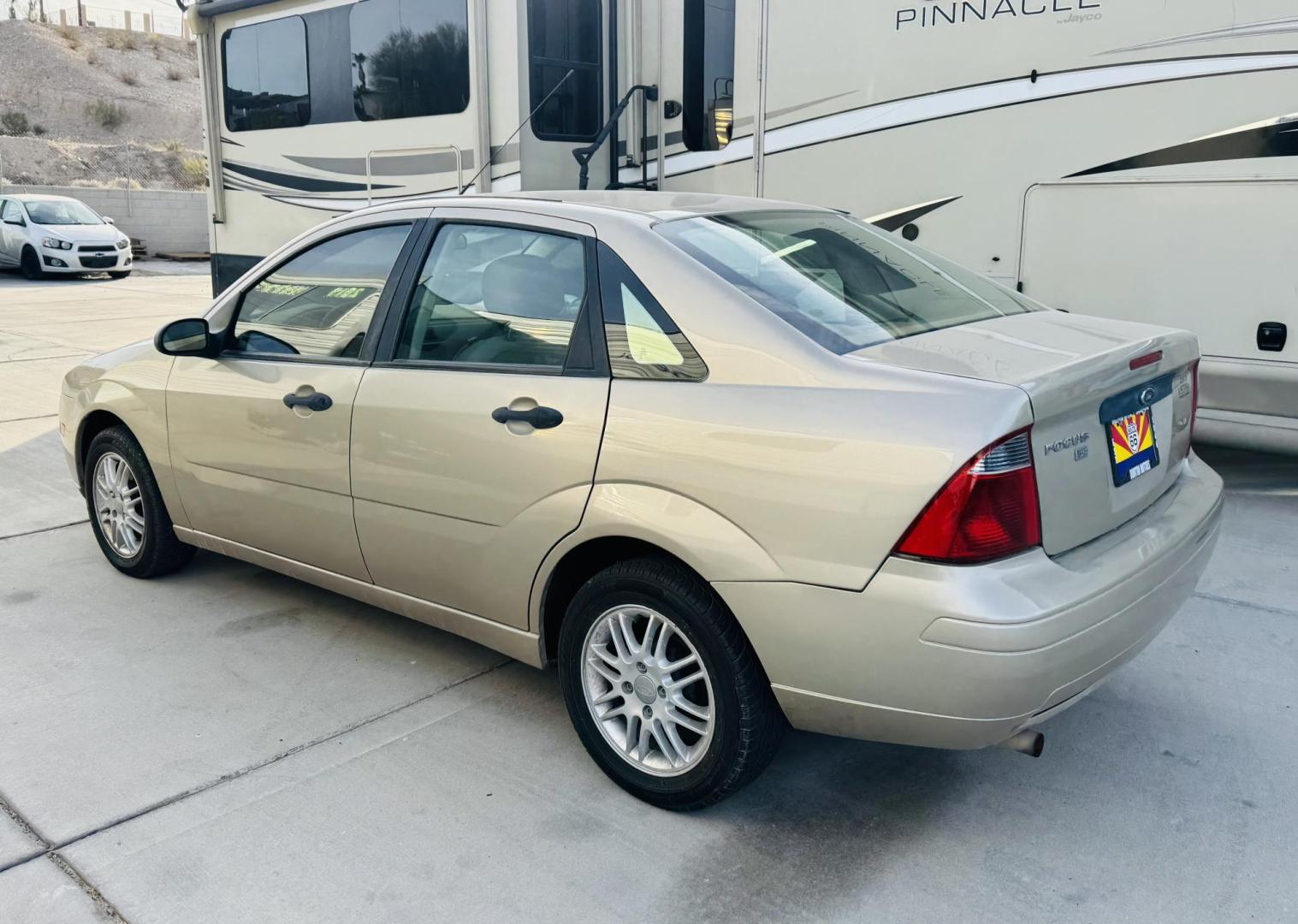 2007 Beige Ford Focus ZX4 S (1FAHP34N07W) with an 2.0L L4 DOHC 16V engine, located at 2190 Hwy 95, Bullhead City, AZ, 86442, (928) 704-0060, 0.000000, 0.000000 - 1 owner. free warranty. free carfax. Arizona car. accident Free. We finance Buy here pay here - Photo#1