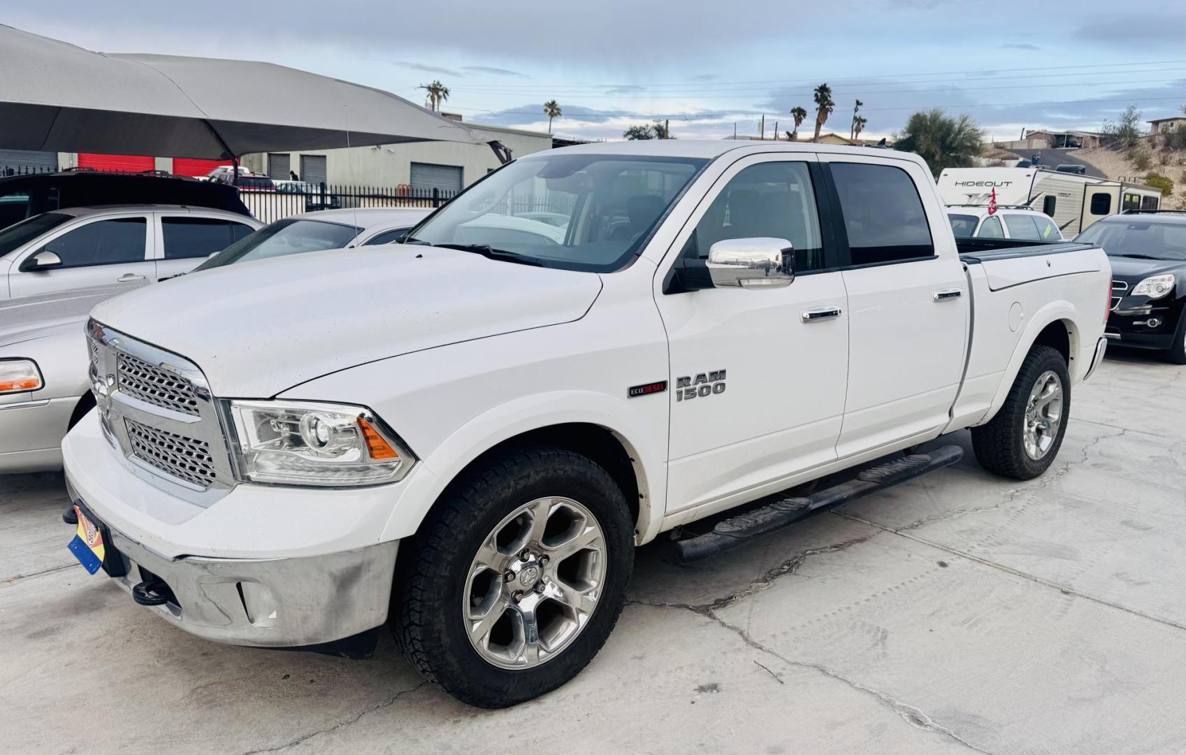 2016 White Ram 1500 , located at 2190 Hwy 95, Bullhead City, AZ, 86442, (928) 704-0060, 0.000000, 0.000000 - 2016 Ram 1500 4x4. Laramie. Leather loaded. diesel 3.0 v6. ram box. bluetooth, heated seats. navigation. weathertech floor guards. Free and clear title. On consignment. financing available. 127k miles. - Photo#0